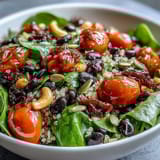 This nutrient-packed Rainbow Salad Bowl features fresh spinach, purple cabbage, and carrots tossed with a light, tangy vinaigrette.