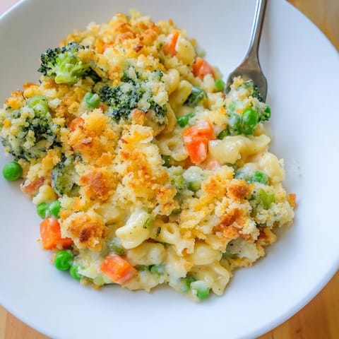 Golden-baked Garden Veg Mac and Cheese in a casserole dish with a crisp panko topping.