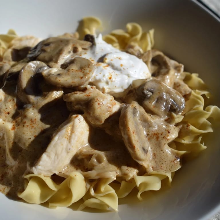 Hearty and comforting, this Chicken and Mushroom Stroganoff features succulent chicken and earthy mushrooms in a rich sour cream sauce.  