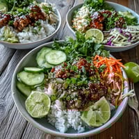 Tender ground turkey coated in spicy bang bang sauce over fluffy rice with crunchy carrots, cucumbers, and cabbage.